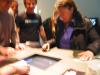 Tilman and Roman of demonstrating Painstation. Tilman tells the two 
excited players to relax, and focus.